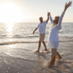 Couple walking on the beach after retiring to Benahavís - Retiring to Spain in 2026 and relocating to the Costa del Sol
