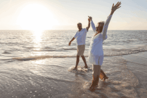 Couple walking on the beach after retiring to Benahavís - Retiring to Spain in 2026 and relocating to the Costa del Sol