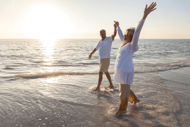 Couple walking on the beach after retiring to Benahavís - Retiring to Spain in 2026 and relocating to the Costa del Sol