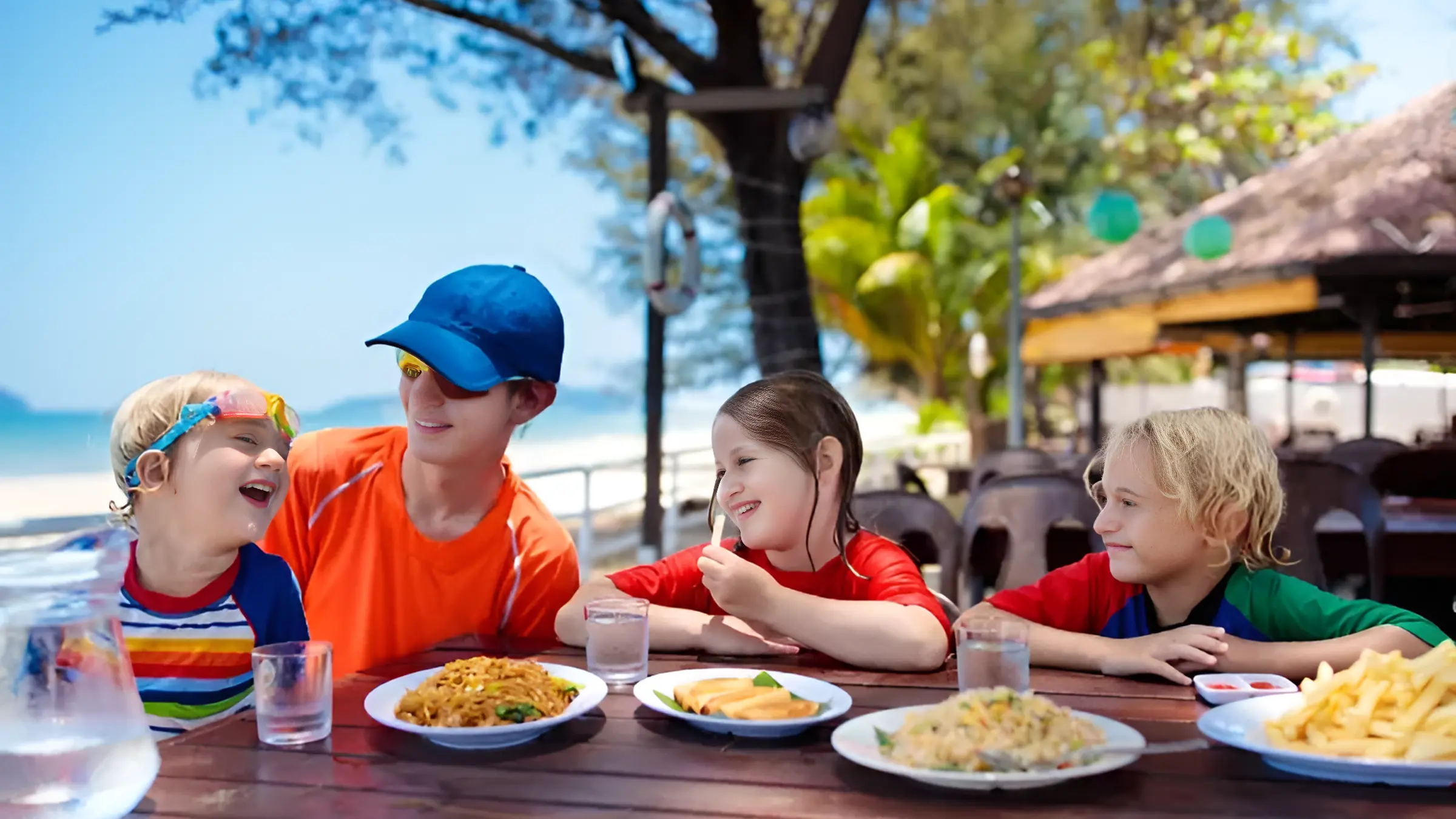 Family eating lunch on a beach in Spain